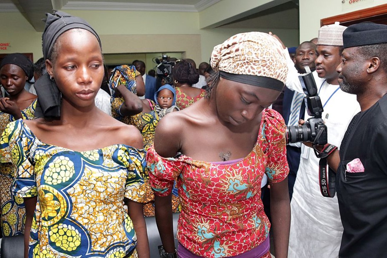 Some of the freed Chibok girls are welcomed by the vice-president on October 13.