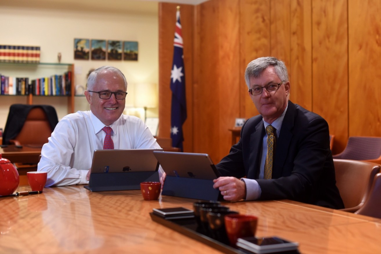 Prime Minister Malcolm Turnbull with Martin Parkinson, who admits the department he oversees is responsible for the security breach.