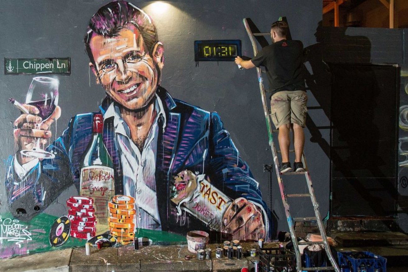 Scott Marsh's finishing his mural of Casino Mike in April 2016.