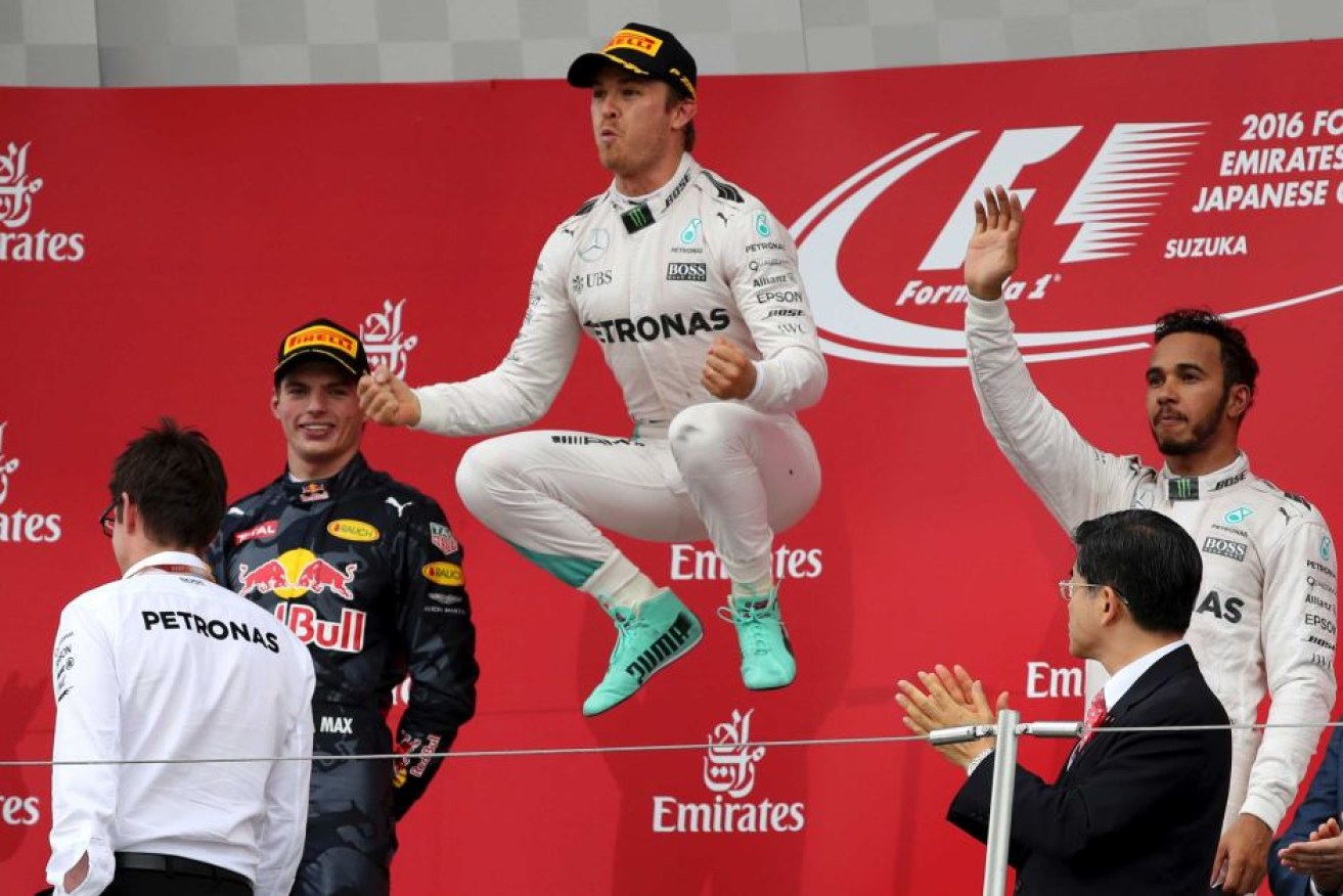 That winning feeling ... Nico Rosberg celebrates on the podium after claiming the Japanese Formula One Grand Prix.
