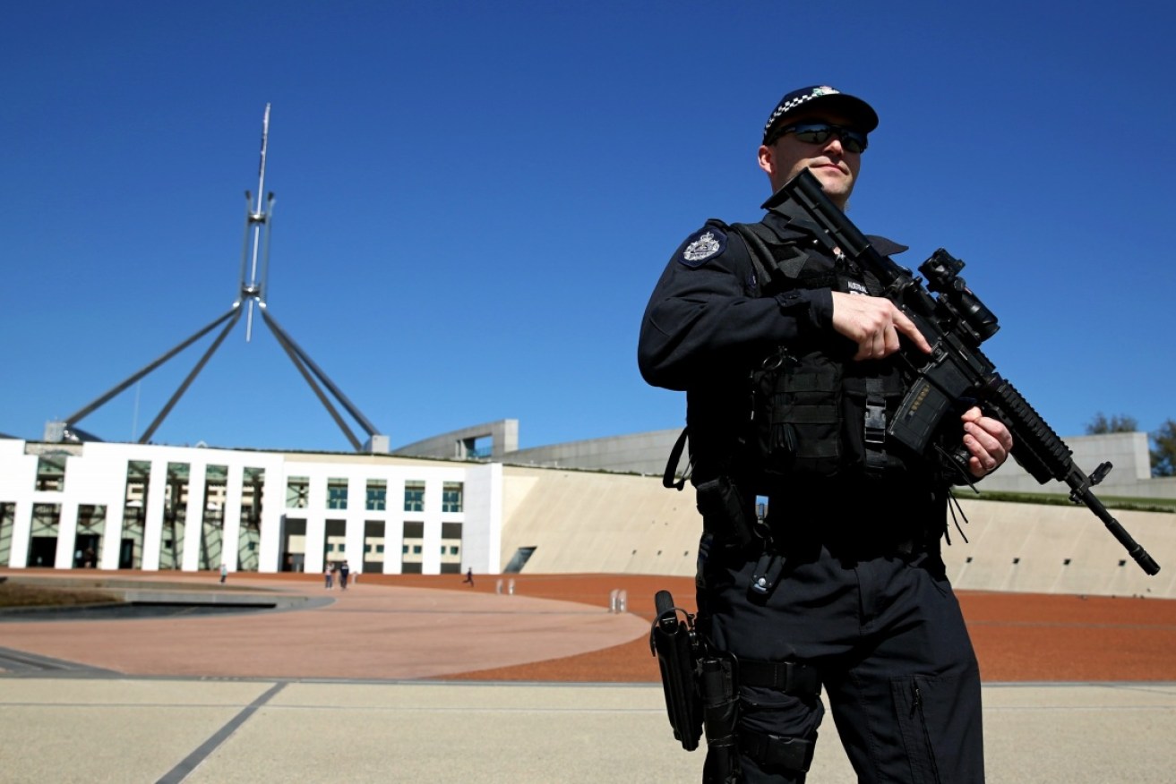 An Australian Federal Police officer outside Parliament House in Canberra.