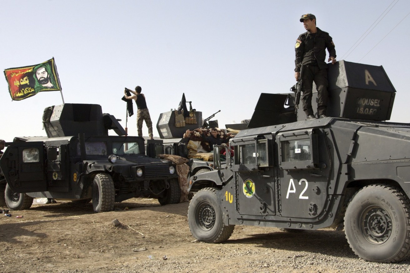 Iraq's special forces soldiers prepare to move into Mosul to battle with Islamic State. 