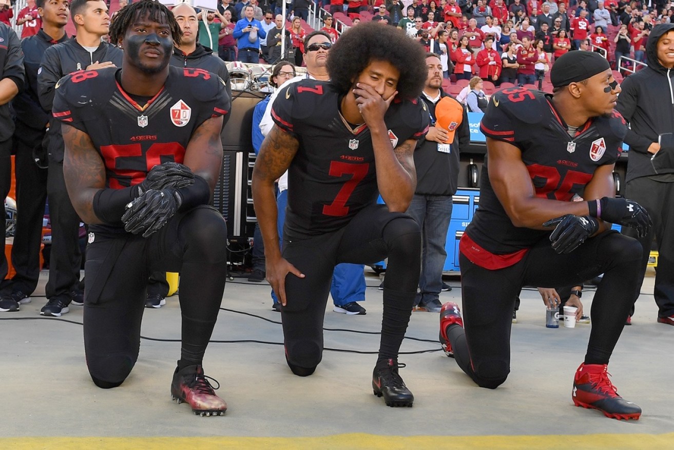 This is what Kaepernick and some of his teammates have been doing during the US national anthem.