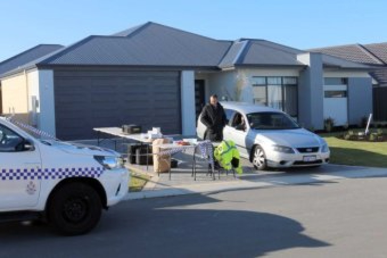 Police at the scene at the Perth home on Friday.