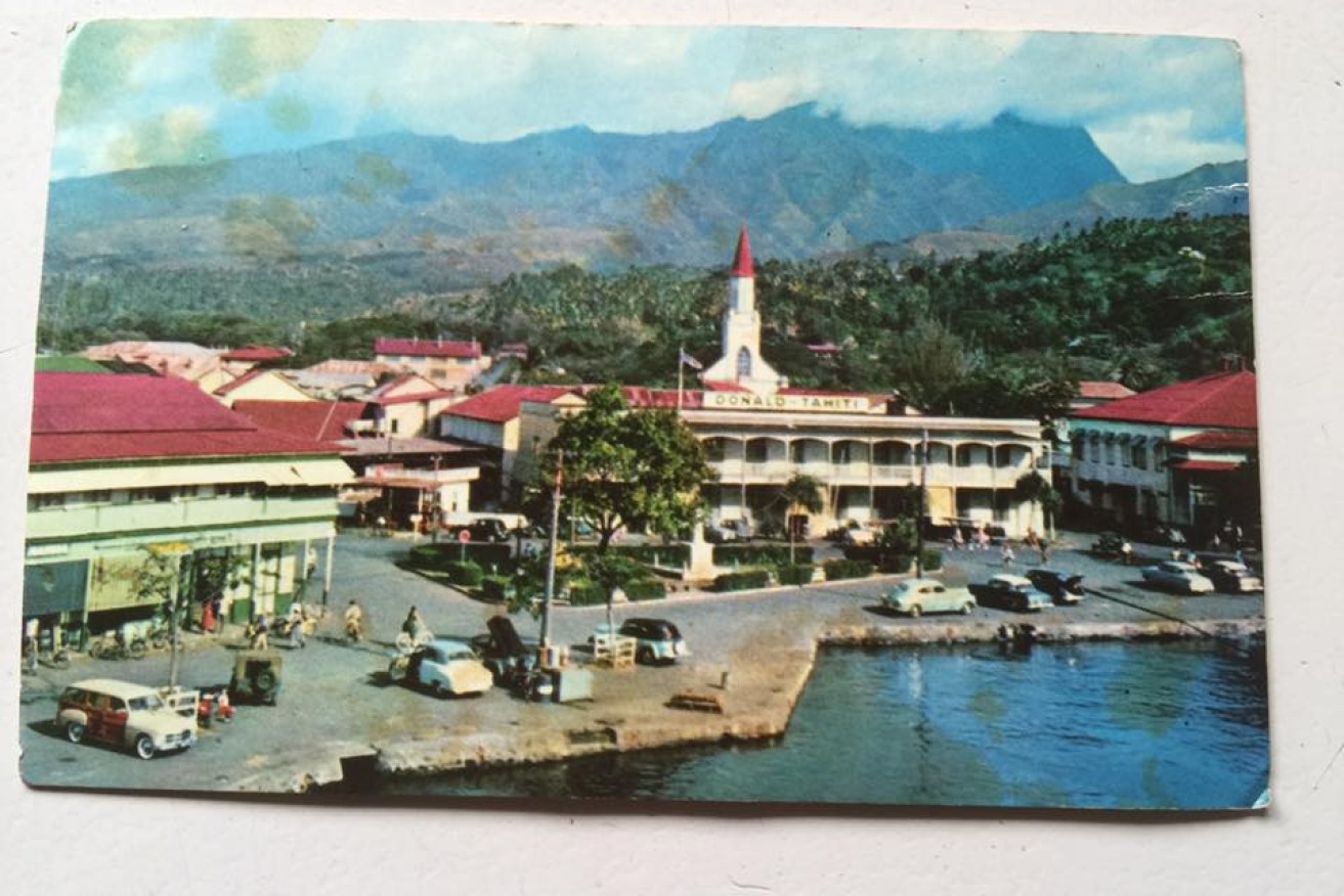 The postcard was sent from Tahiti and featured an iconic building as its focal point. 