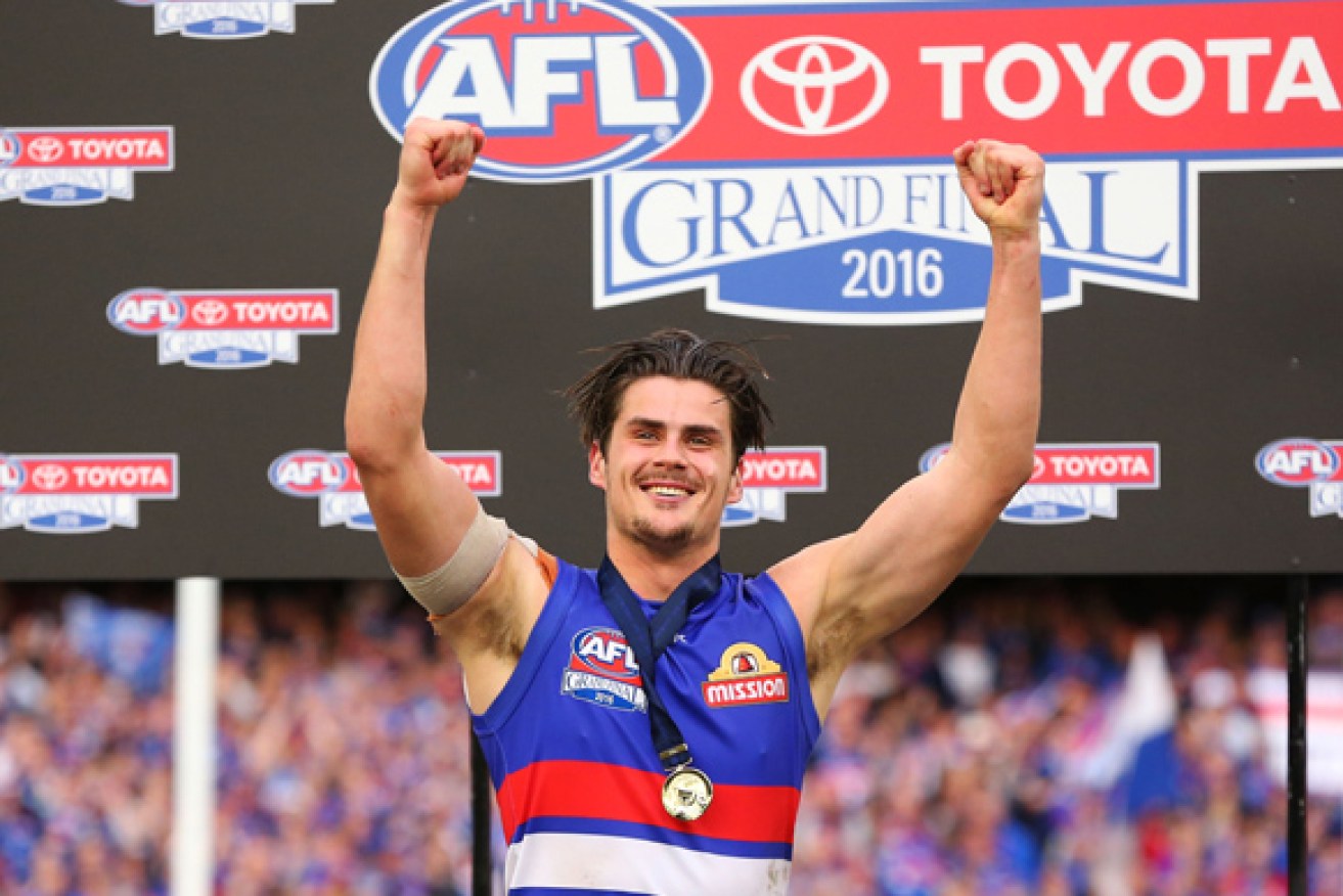 Tom Boyd celebrates after his big 2016 grand final game. 