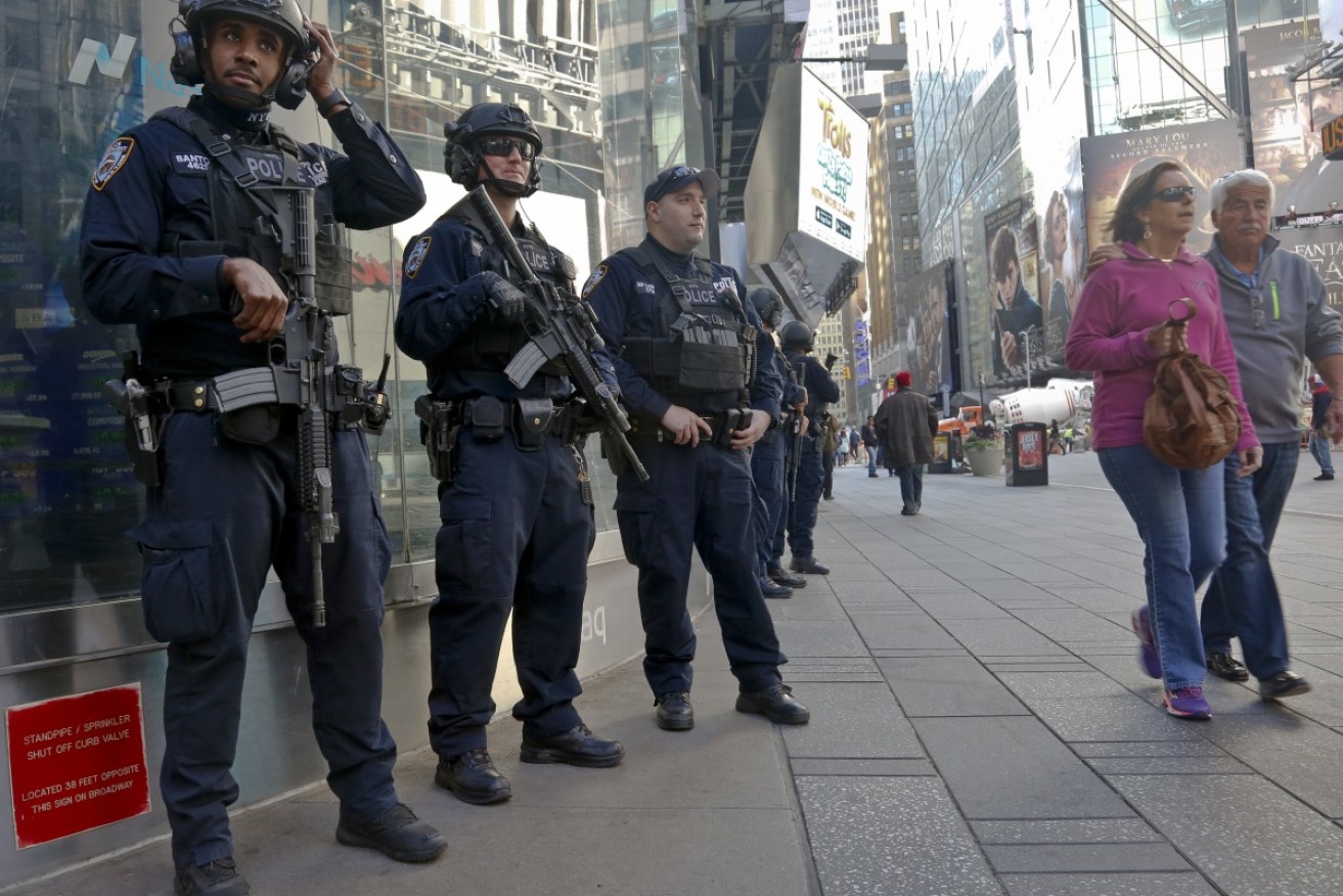 Officers from the NYPD anti-terror unit patrol Times Square on Friday. 