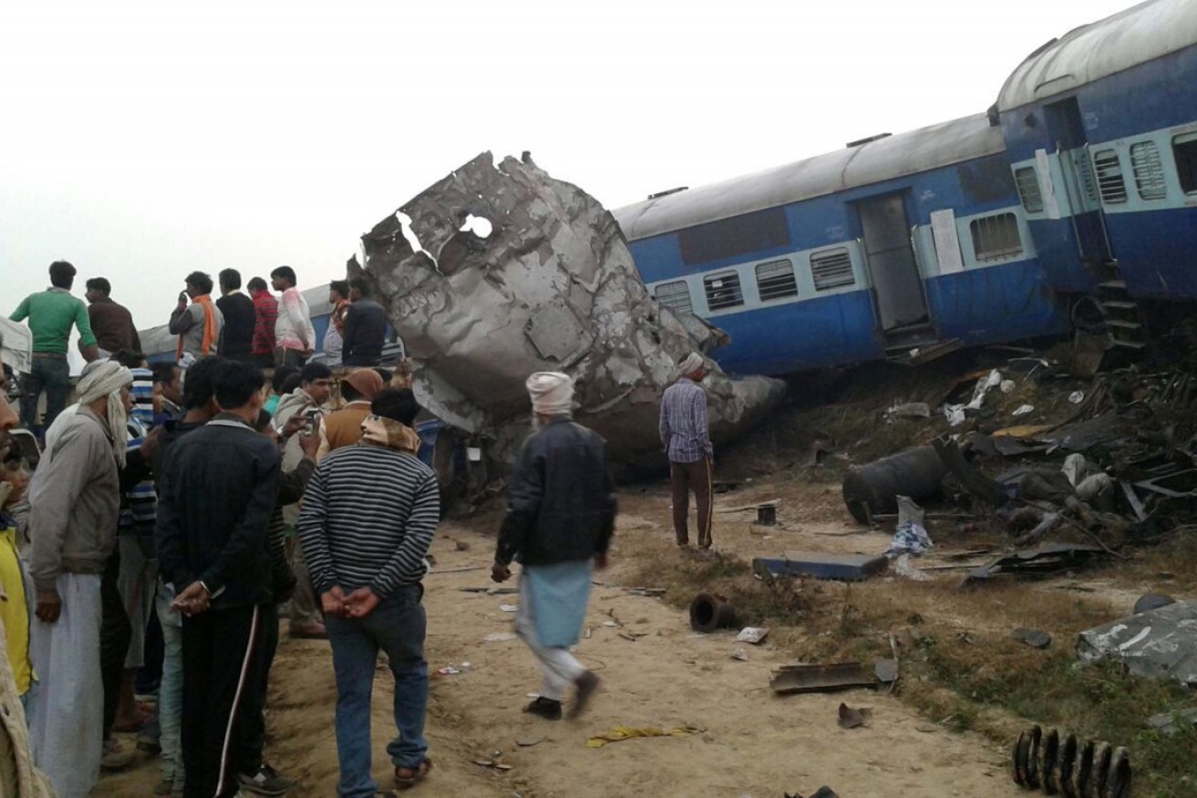 Rescue officials on the spot where 14 coaches of the Indore–Patna express derailed.