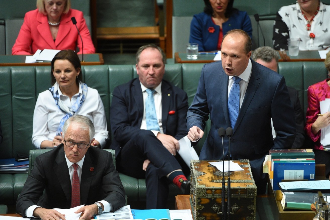 Immigration Peter Dutton has been roundly condemned -- and praised for his bravery by Tony Abbott.