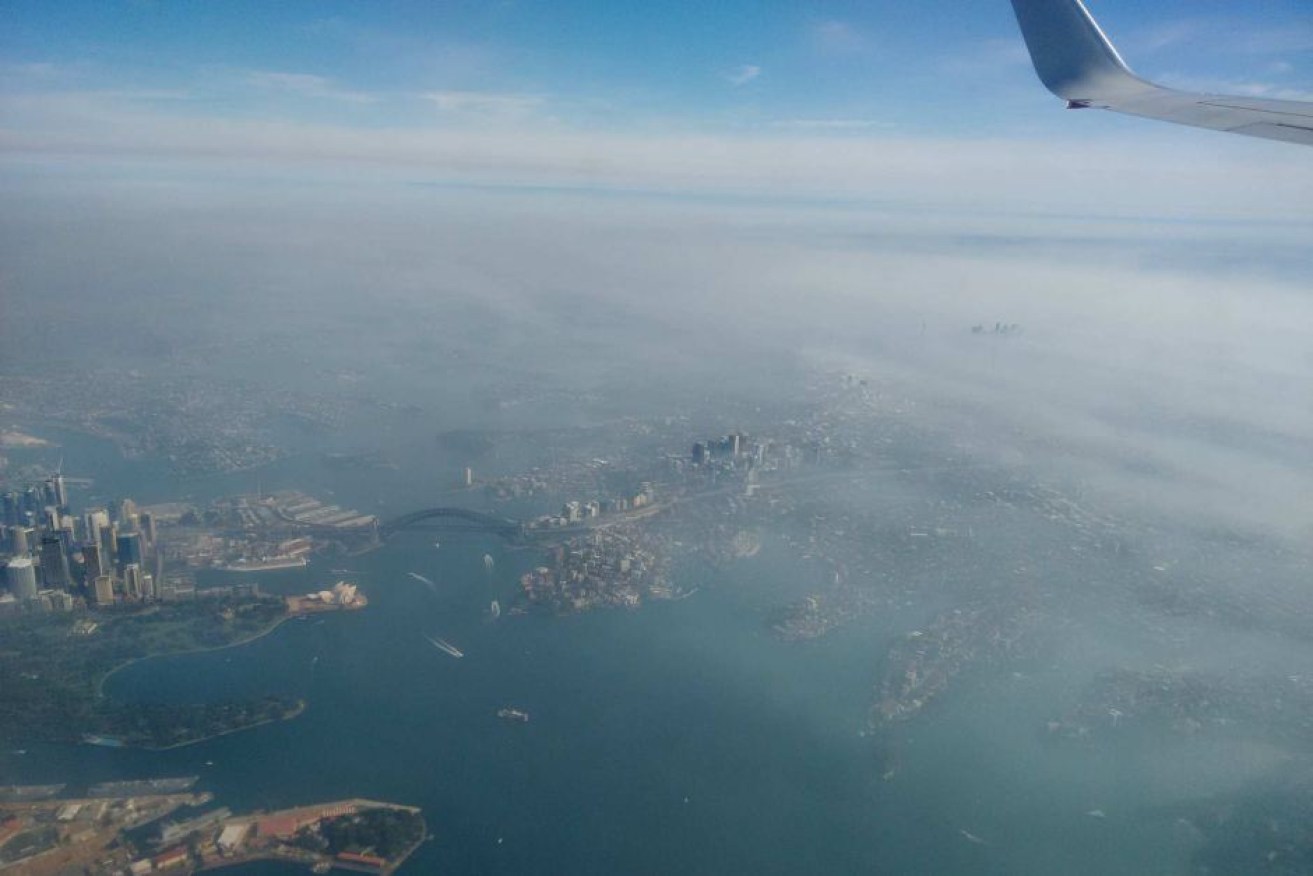 Sydney Harbour was shrouded in smoke during hazard reduction burns in May.