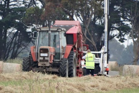 Farmer critical after being pinned under hay baler