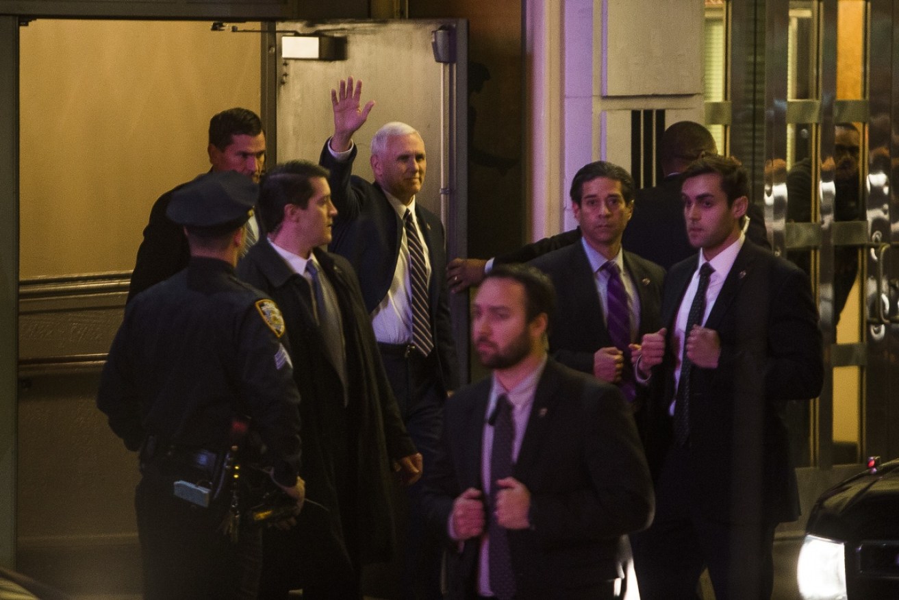 Mike Pence leaves the performance of <i>Hamilton</i> to protestors and some supporters. 