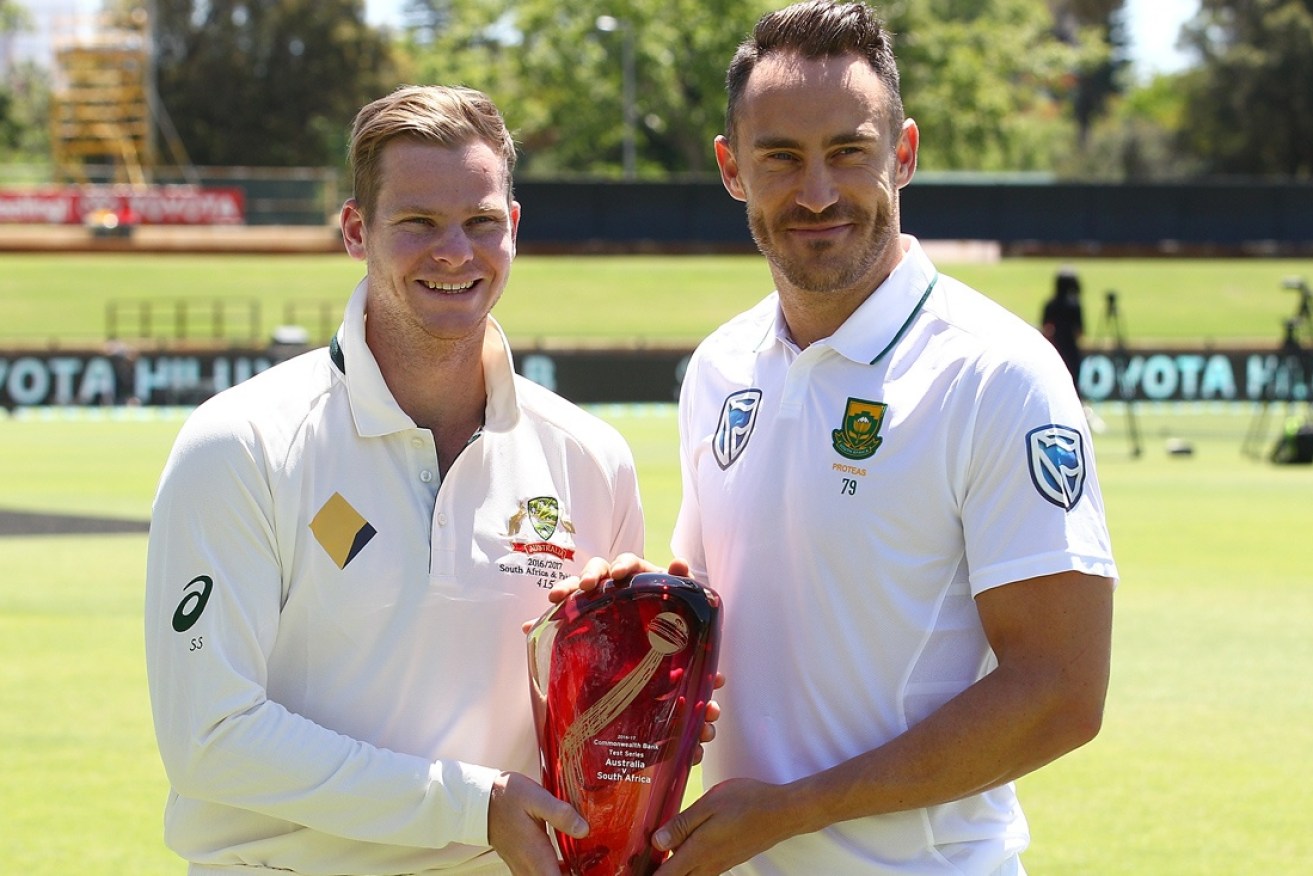 The captains pose with the Test series trophy.
