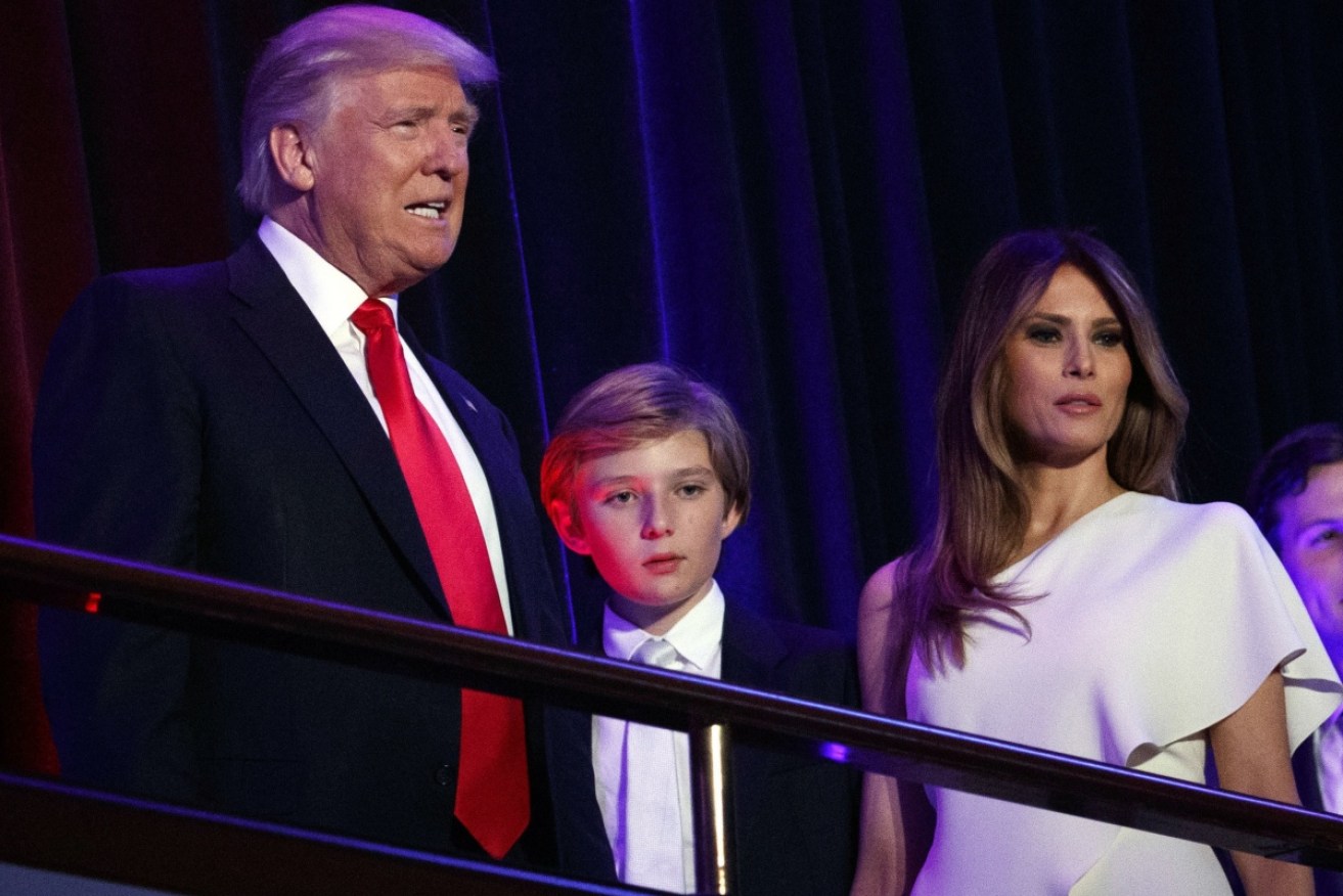 Barron Trump greets crowds with his father Donald Trump and mother Melania Trump. 