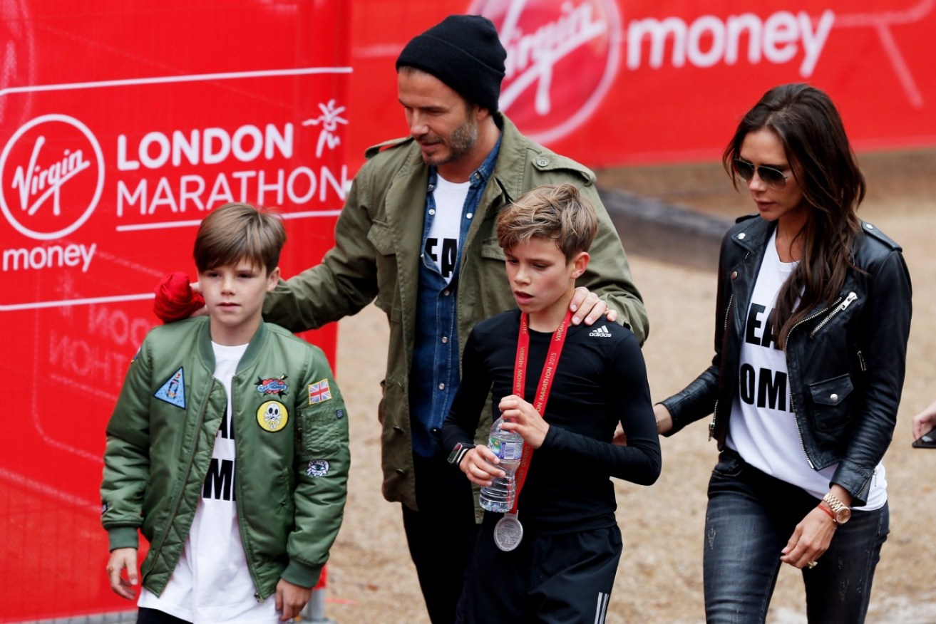 Cruz Beckham (left) picture with dad David, brother Brooklyn and mum Victoria at the 2015 London Marathon.