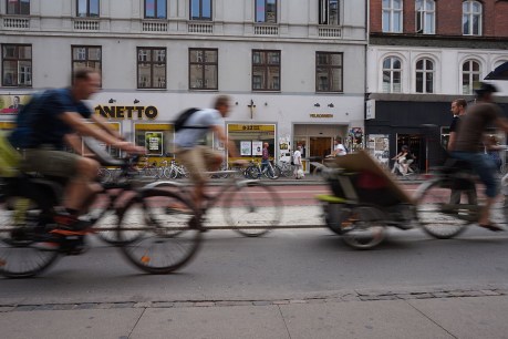 Bikes overtake cars on streets of Copenhagen