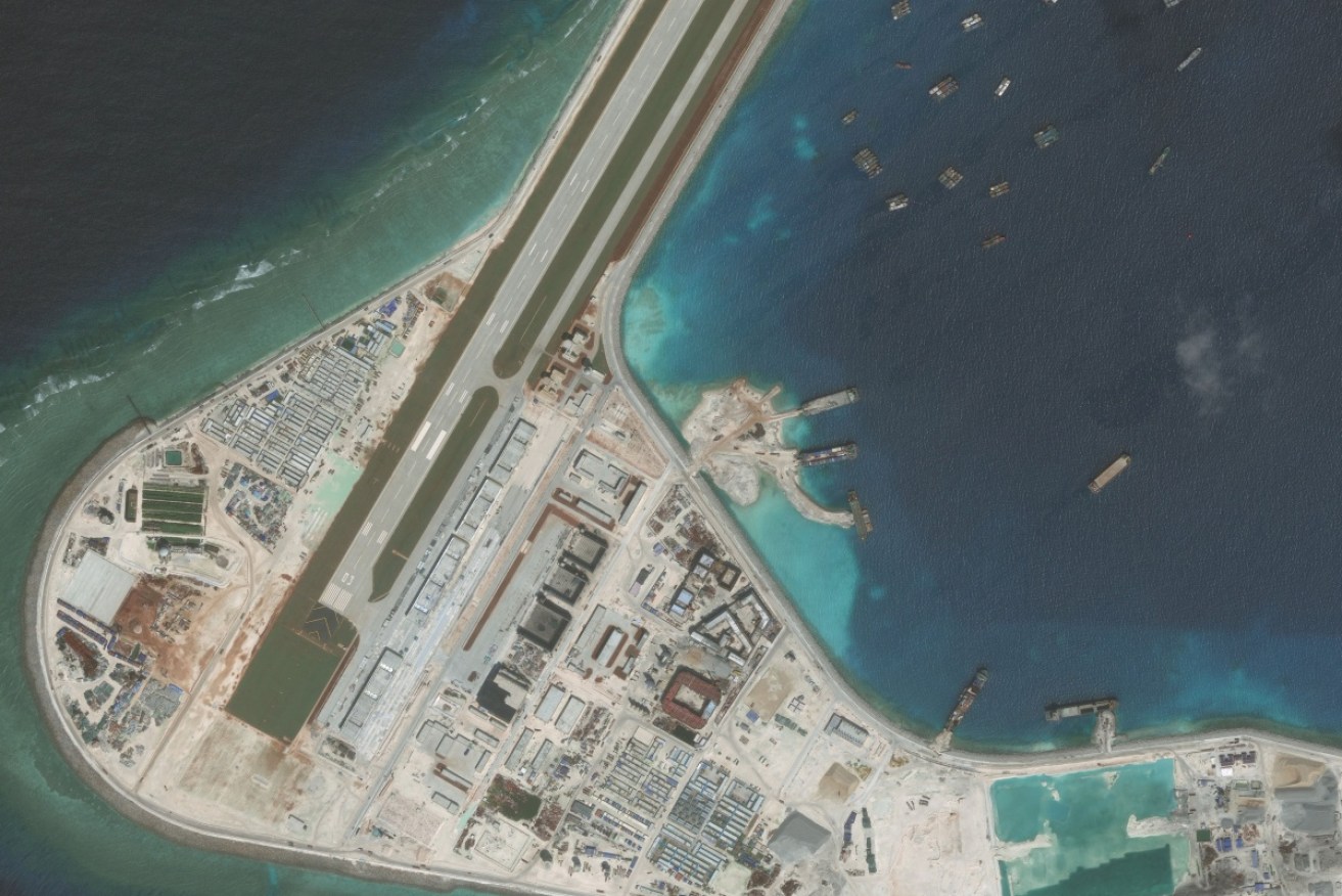 China is converting reefs to military facilities by building artificial islands in the South China Sea.
