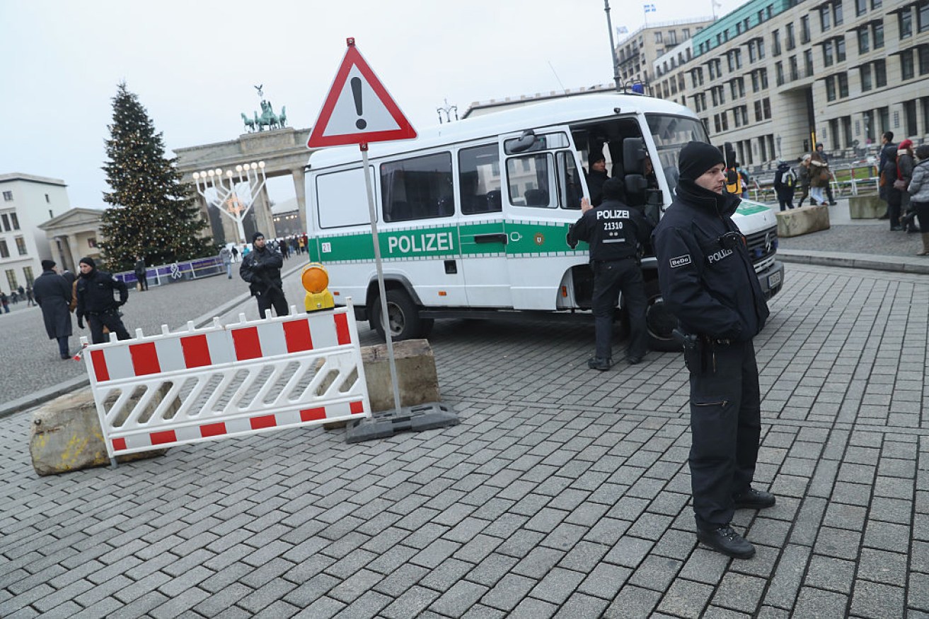 Heavily-armed police stand near the Brandenburg Gate, as authorities remain on high alert.