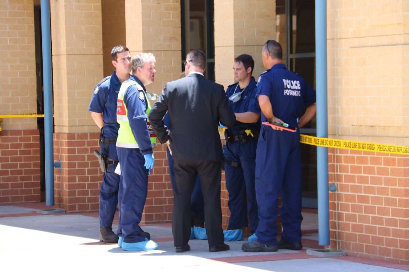 Police and forensics officers remain at Joondalup courthouse where the woman was attacked.
