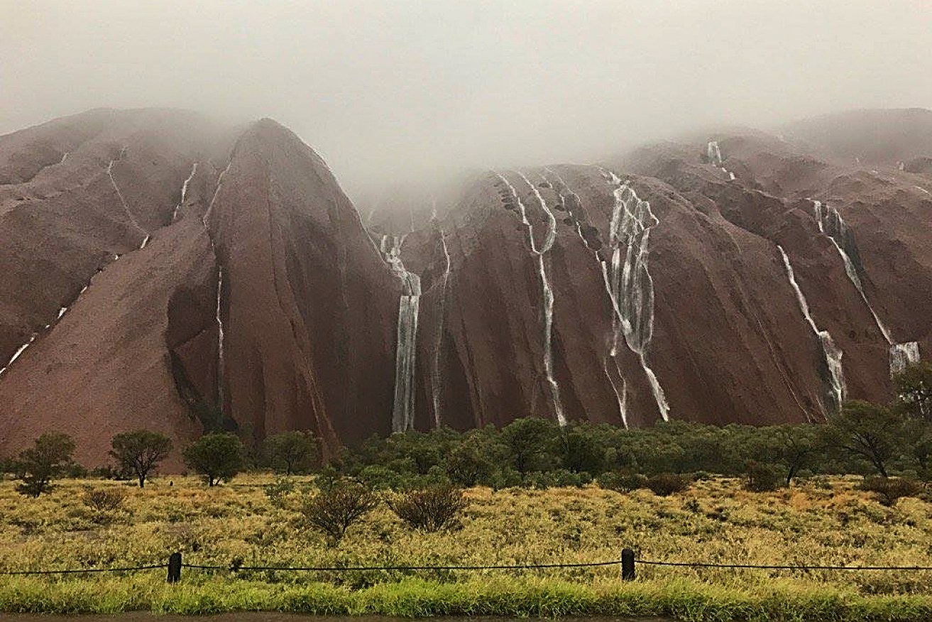 Uluru has reopened after it was closed by flash flooding on Boxing Day.