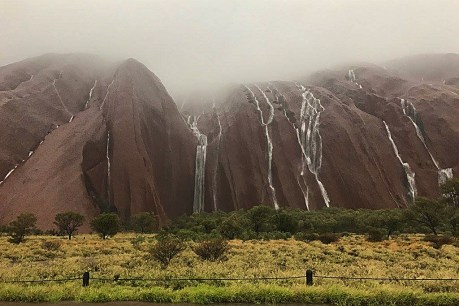 Uluru puts on spectacular show after one-in-50-year rainfall