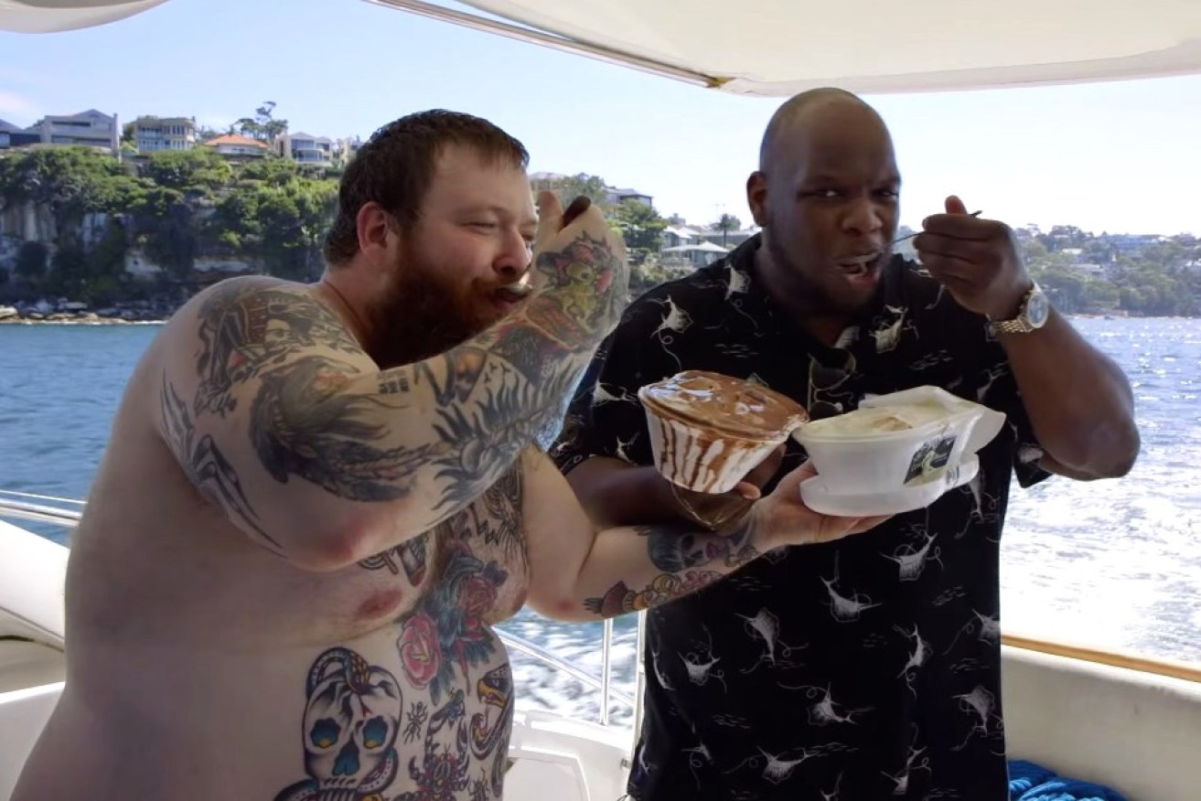 Action Bronson (left) and his friends don't mess around when it comes to eating.