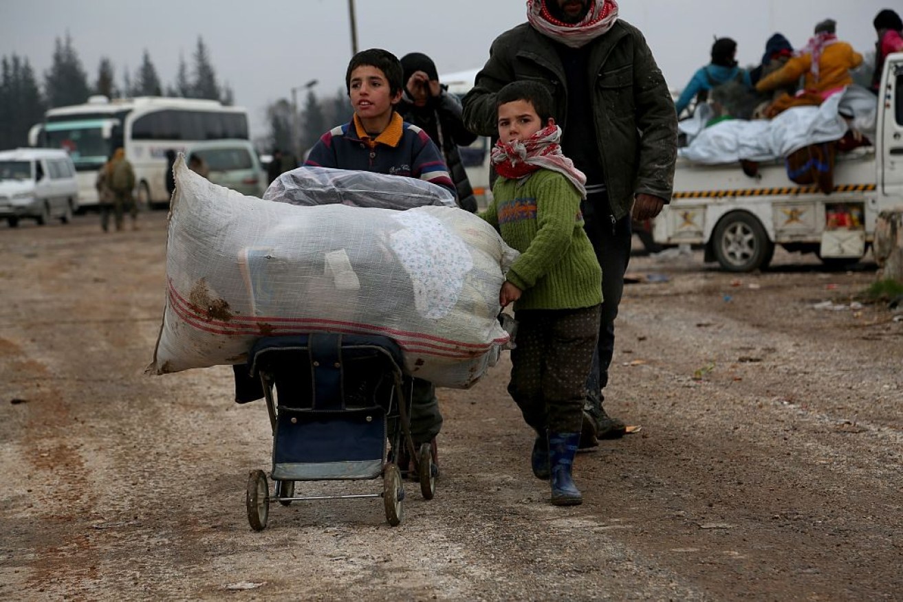 A family evacuates from east Aleppo on December 19. 