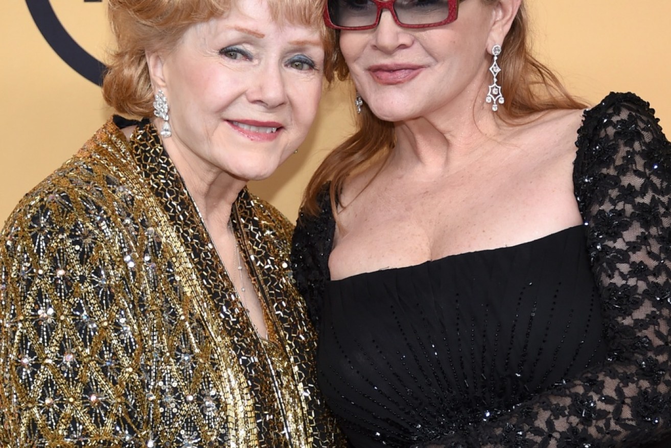 Debbie Reynolds (left) with her daughter, Carrie Fisher, was passed away on December 28 (AEDT).