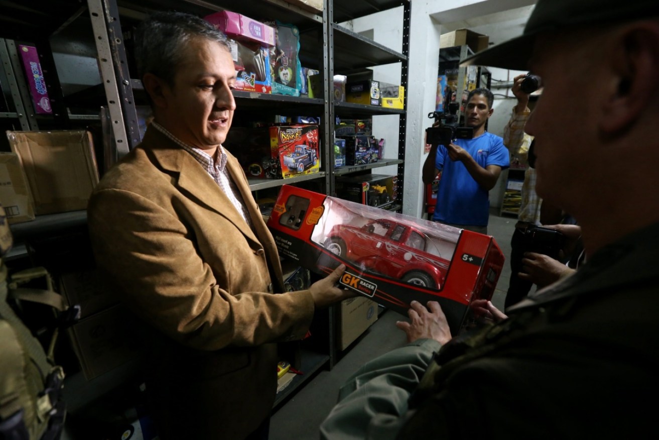 Venezuela's pricing authority director, William Contreras, led a move to seize 4 million toys from a local company.