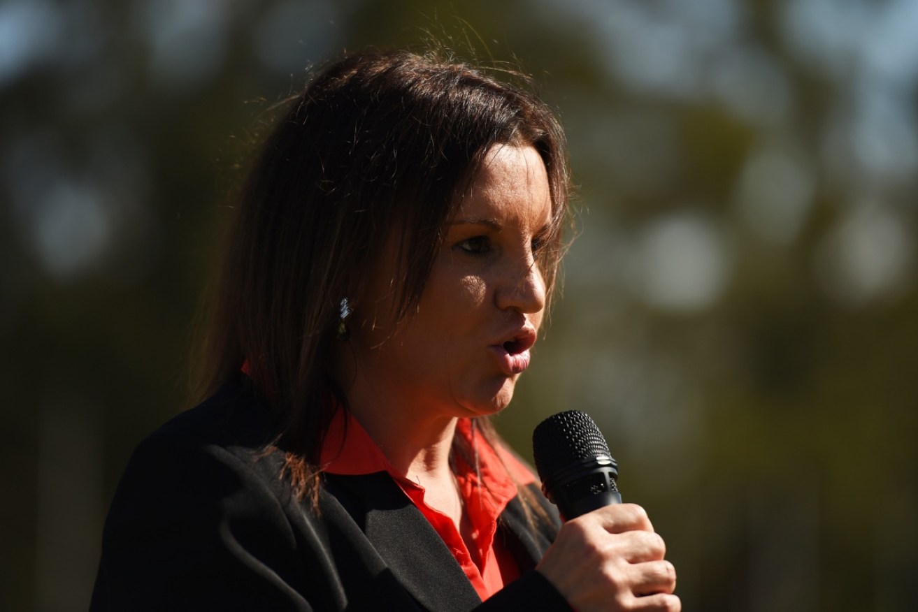 Senator Jacqui Lambie says she is considering her position on the cuts.