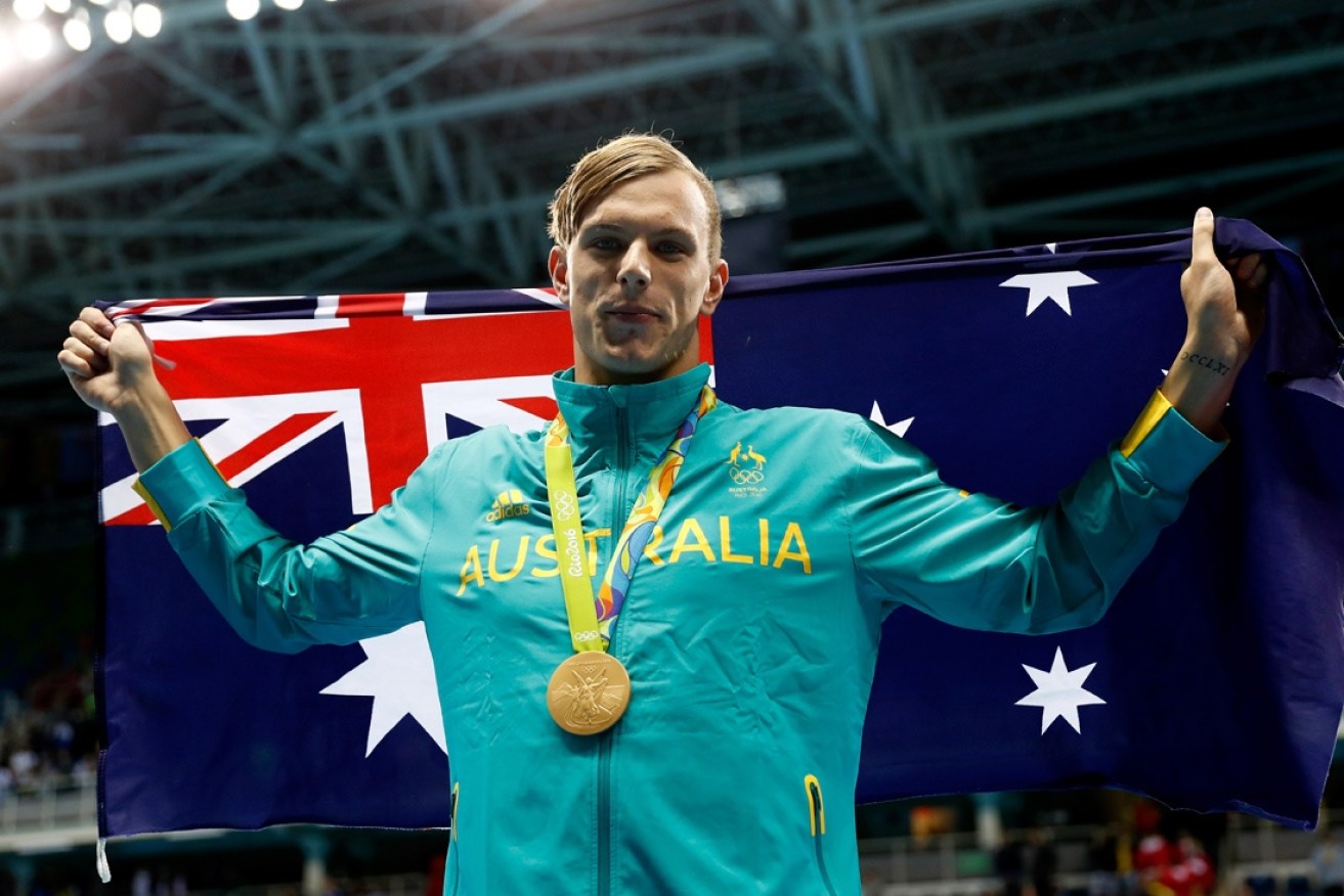Kyle Chalmers celebrates his gold medal success in Brazil.