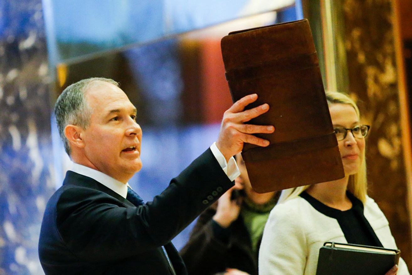 Scott Pruitt arrives at Trump Towers last month to meet with the President-elect.