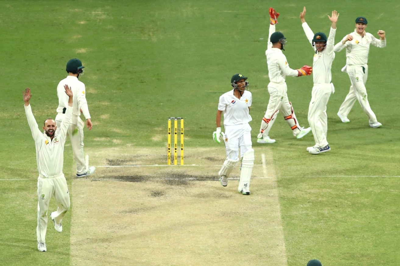 The Australians celebrate after Younis Khan's mind-boggling reverse sweep. 