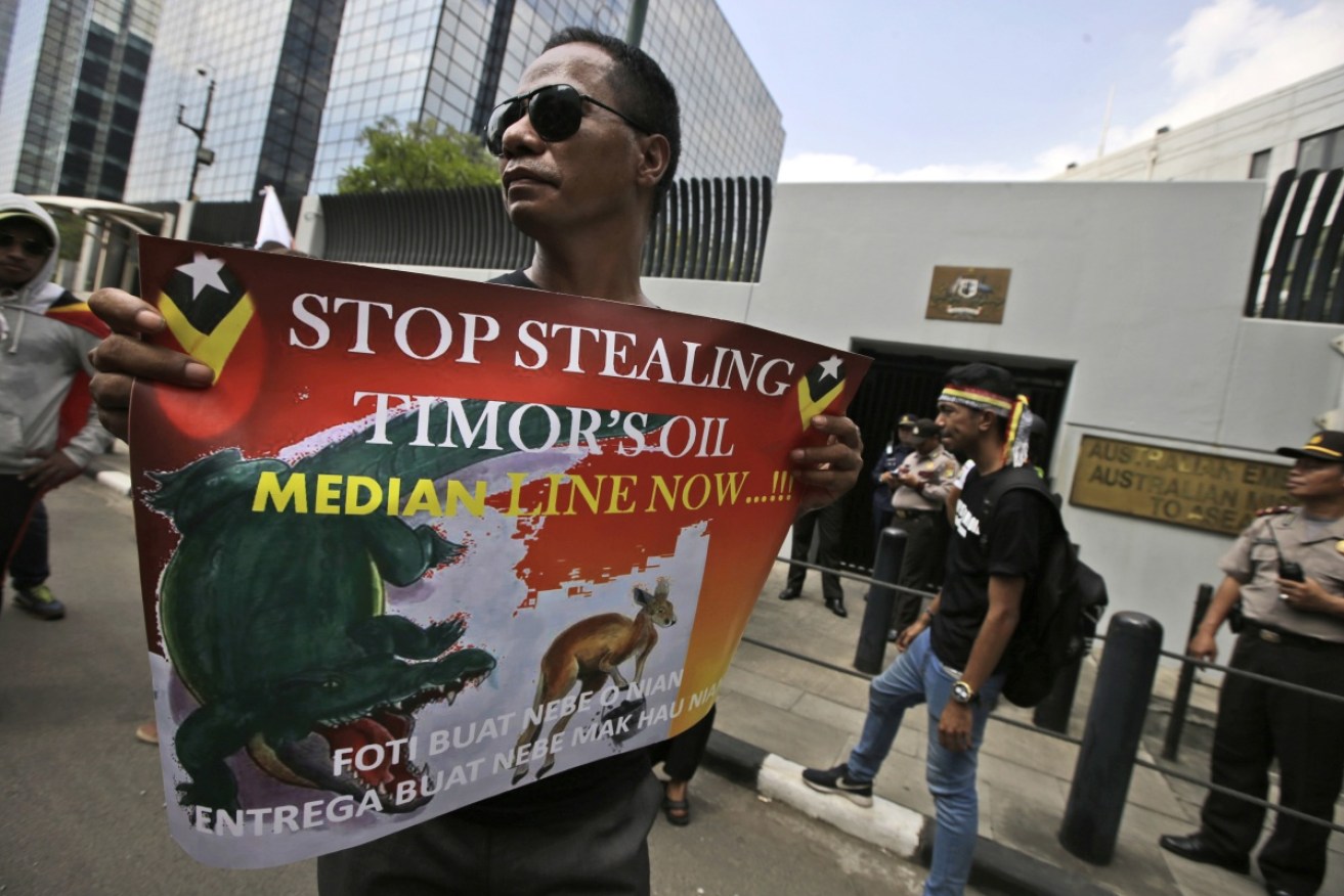A Timorese protester accuses Australia of theft at a protest outside the Australian Embassy in Jakarta.