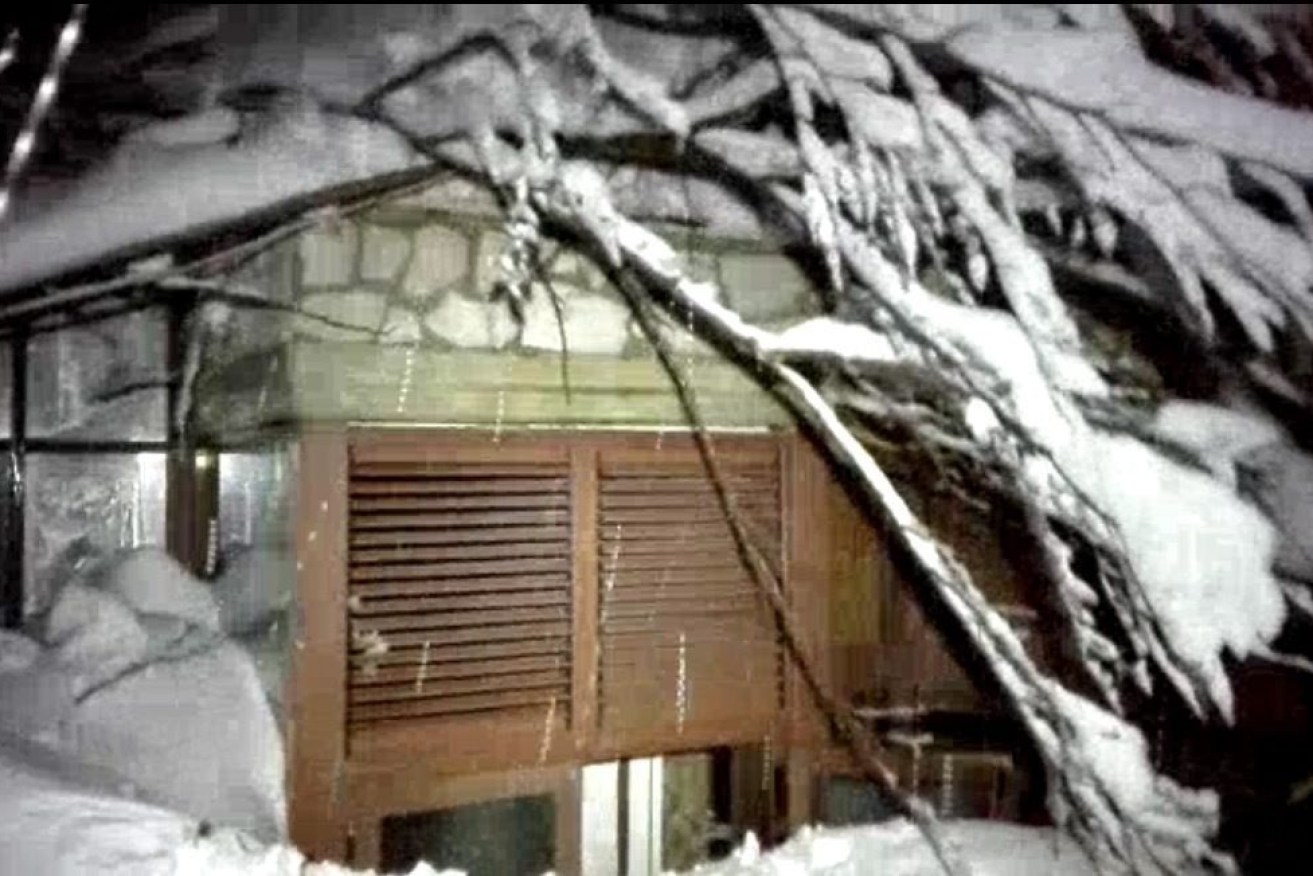 A handout picture provided by rescuers shows the hotel Rigopiano after it was hit by an avalanche.