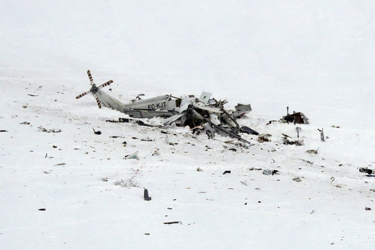 The wreckage of the helicopter lies in snow in the Campo Felice ski area in central Italy. 