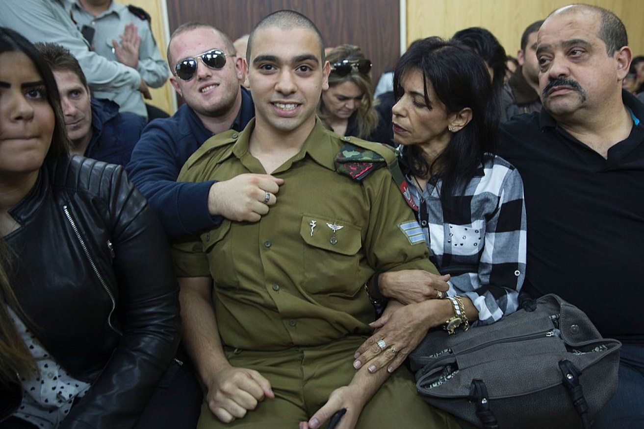 Israeli soldier Elor Azaria (C), who shot dead a wounded Palestinian assailant awaiting the verdict. 