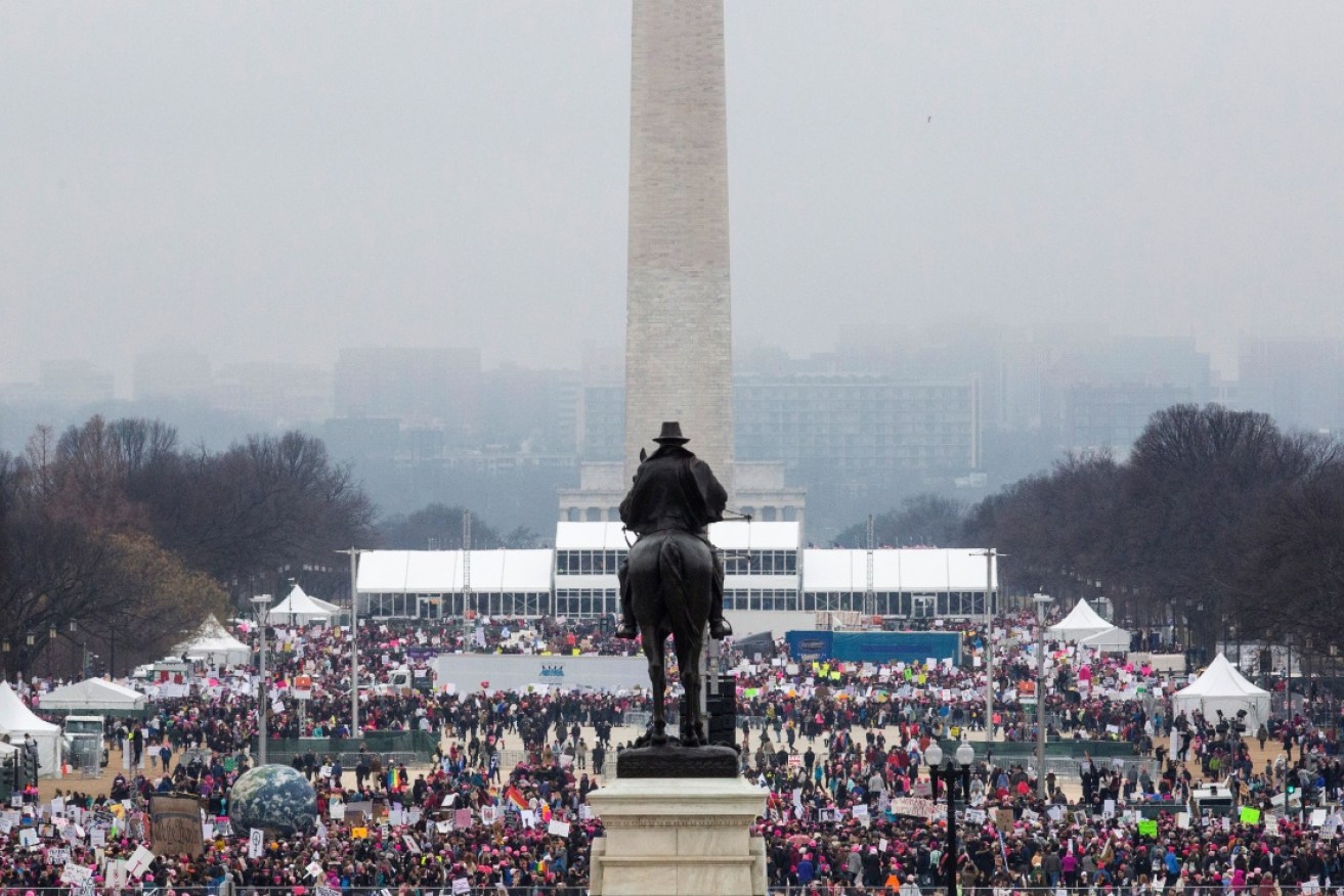 Protesters crowd the National Mall in Washington DC, during the Womens March.