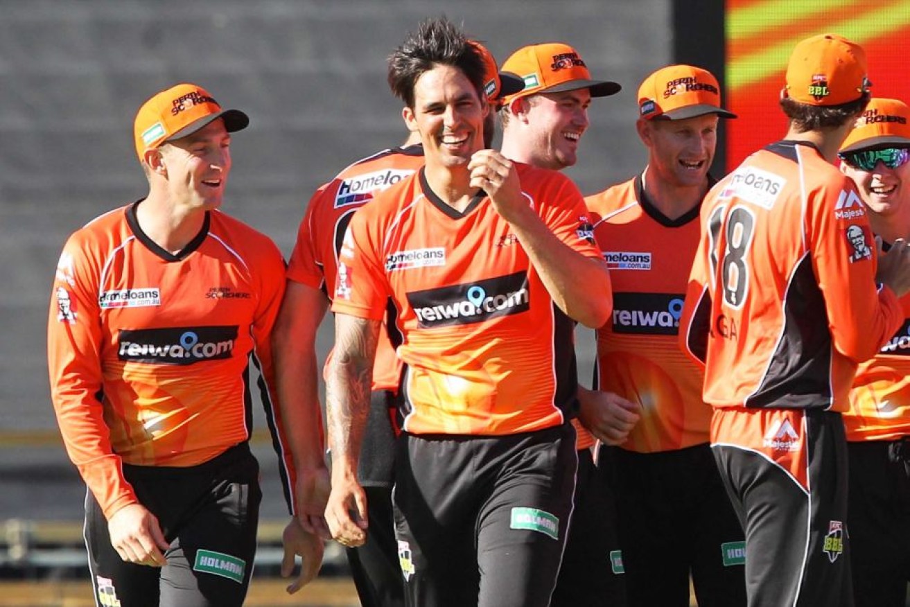 Mitchell Johnson (C) celebrates dismissing Rob Quiney with the first ball of the match.