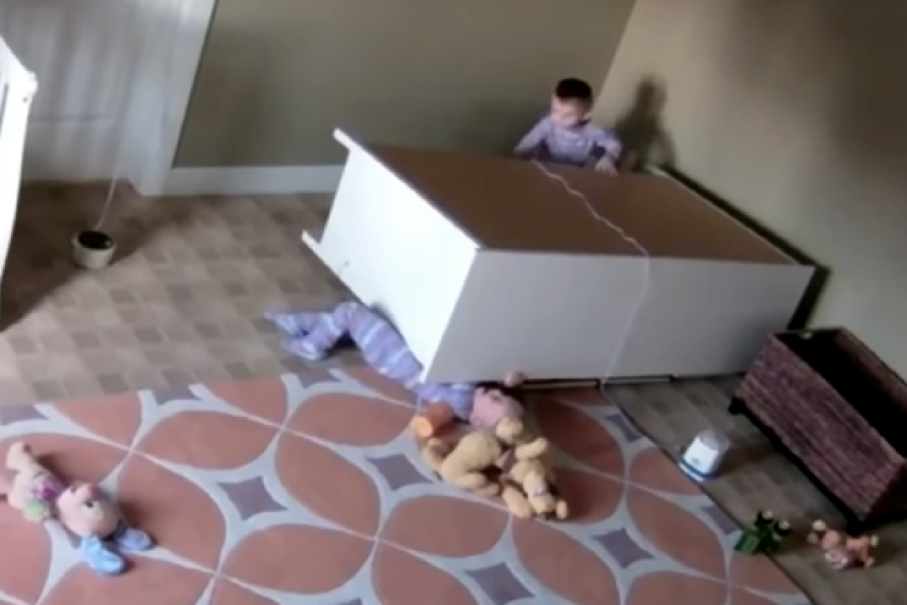 The video shows Bowdy pushing a fallen dresser off his twin brother Brock.