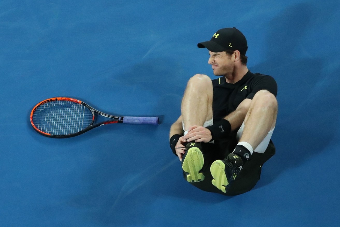 Andy Murray winces in pain during his second round match at the Australian Open. 