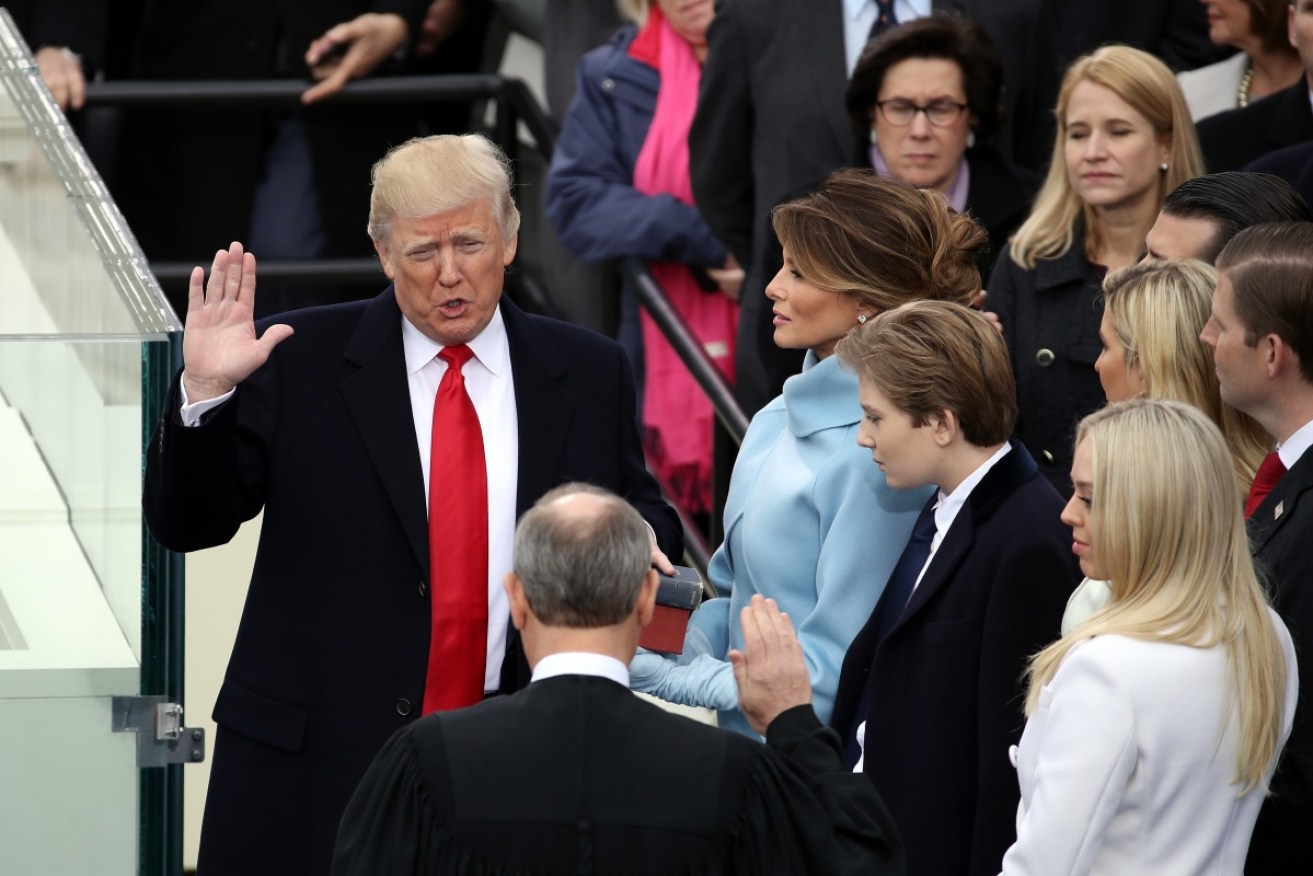 Donald Trump takes the oath of office as president.