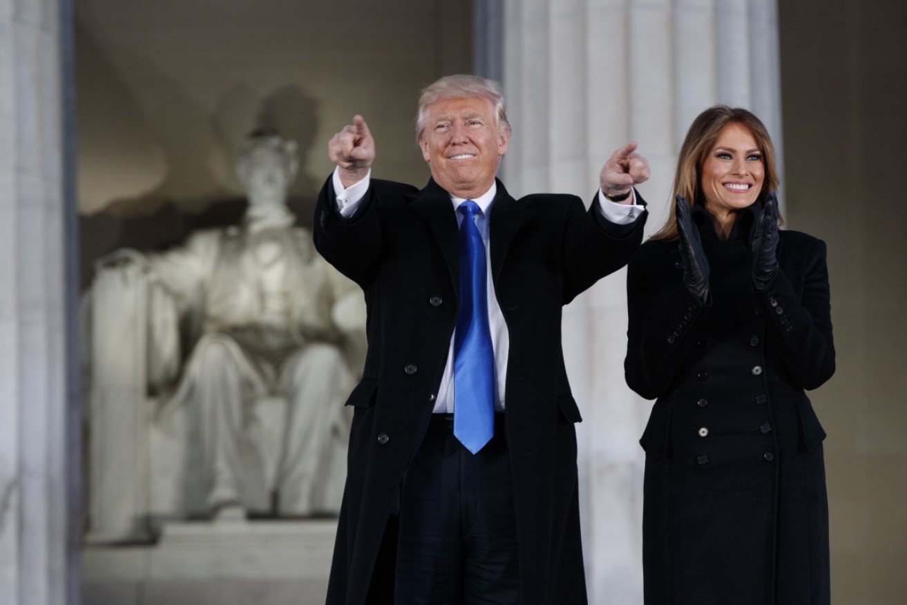 Donald and Melania Trump greet the concert crowd in front of the Lincoln Memorial. 