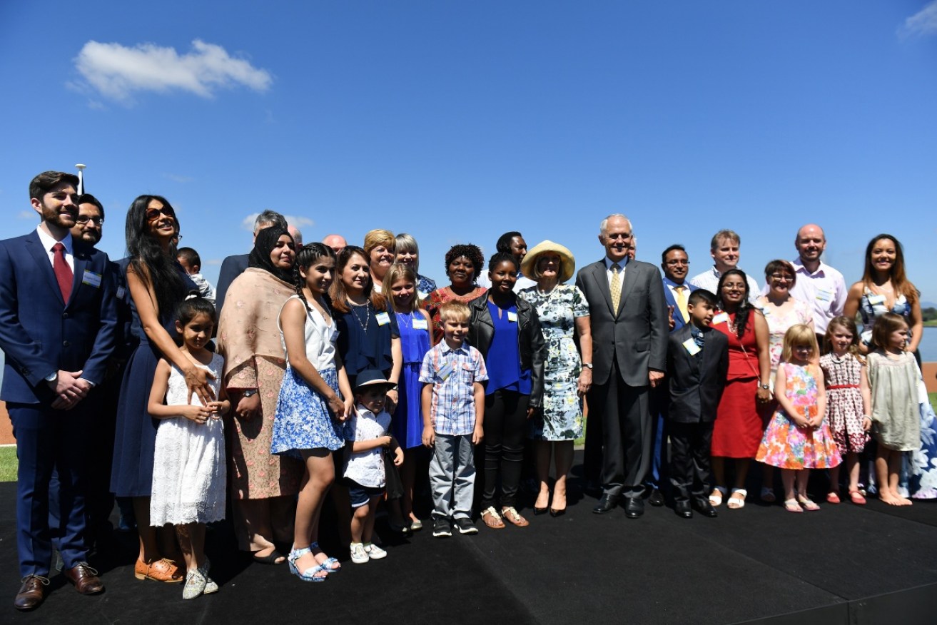 Malcolm Turnbull poses with Australia's newest citizens after a ceremony in Canberra. 