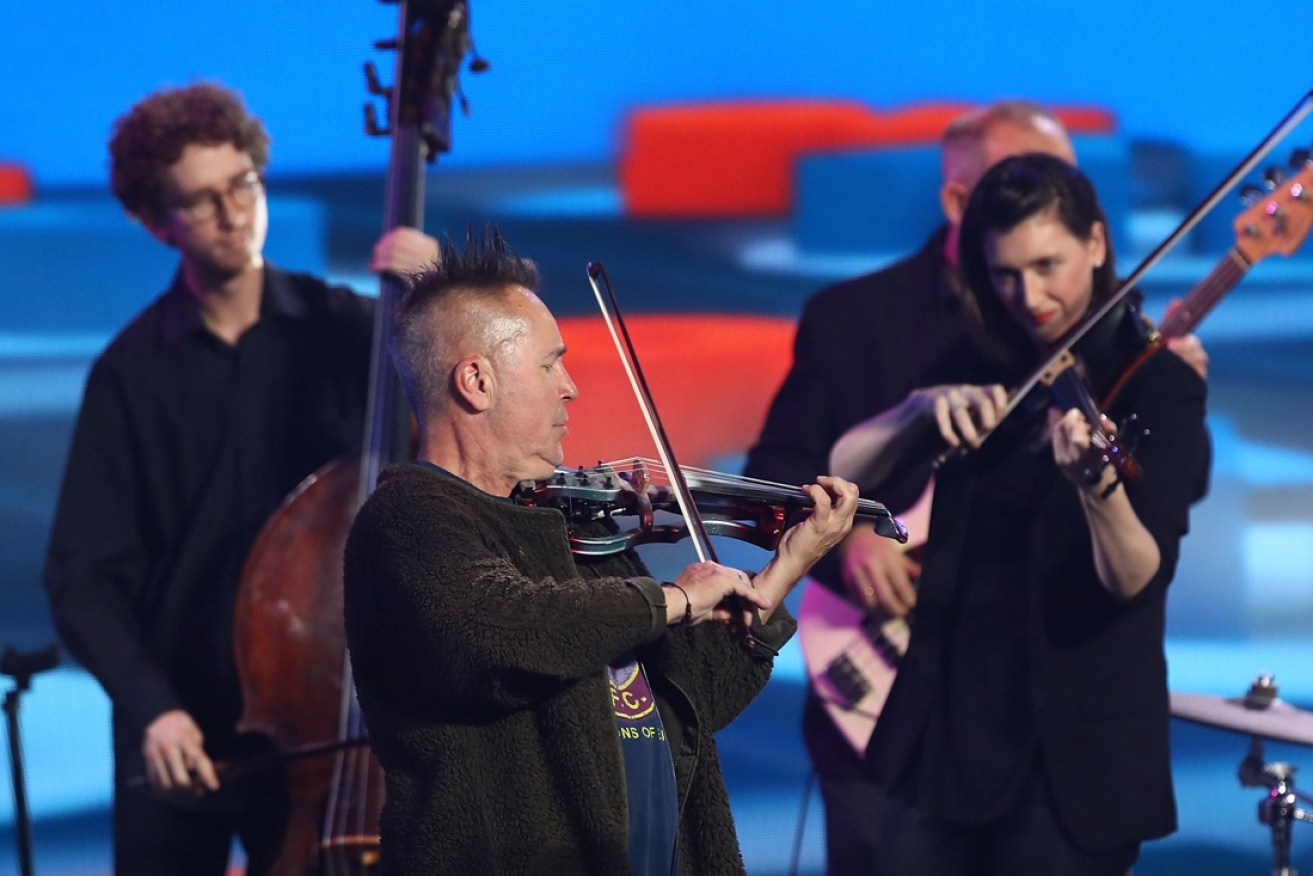 Nigel Kennedy and his orchestra play at the Australian Open.