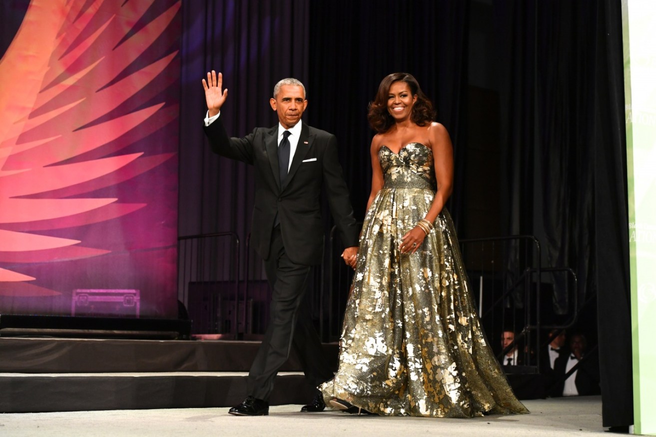 Barack and Michelle Obama are getting lots of practice at accepting awards, including his latest, an Emmy. <i>Photo: Getty</i>
