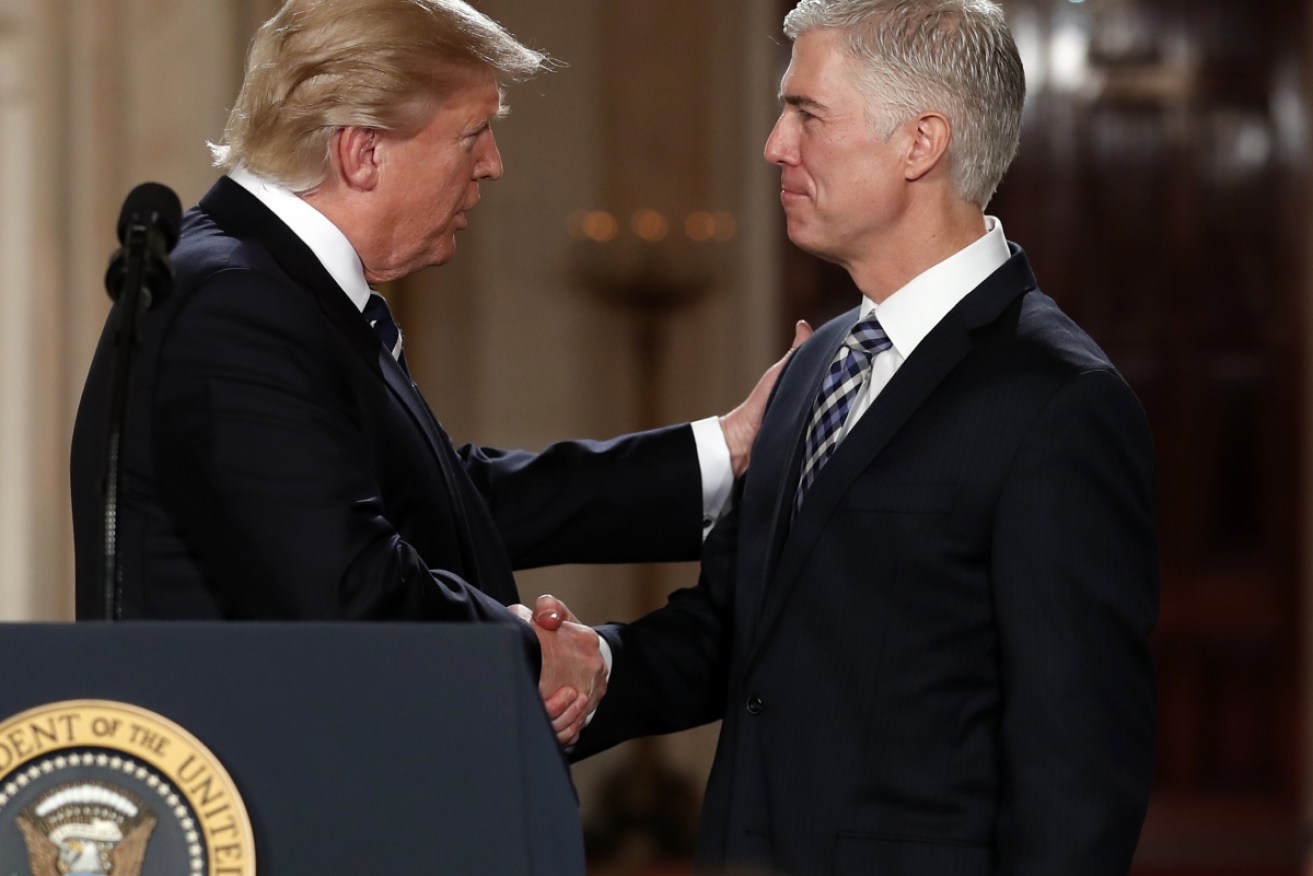 President Donald Trump shakes hands with 10th US Circuit Court of Appeals Judge Neil Gorsuch. 