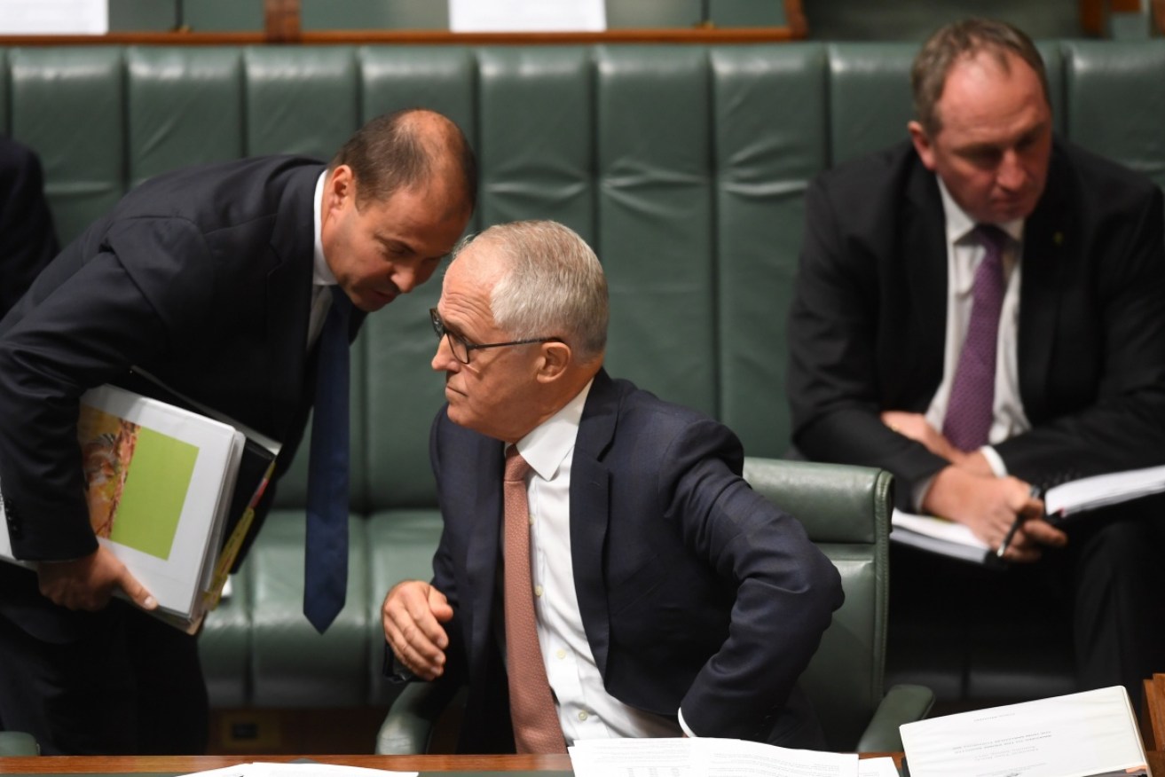 Prime Minister Malcolm Turnbull speaks to Energy Minister Josh Frydenberg during Question Time.
