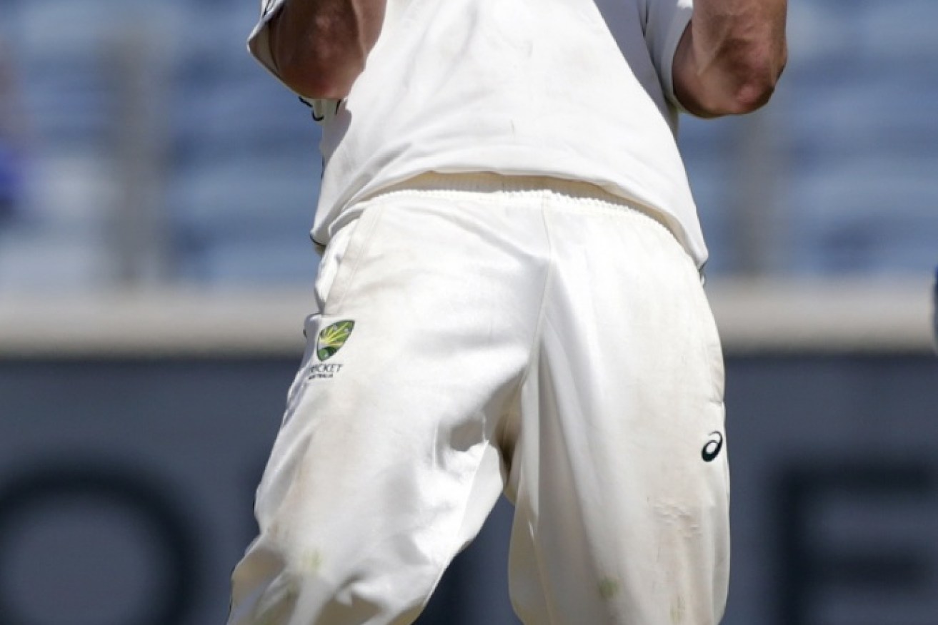 Australia's Steve O'Keefe celebrates the dismissal of India's Ajinkya Rahane.