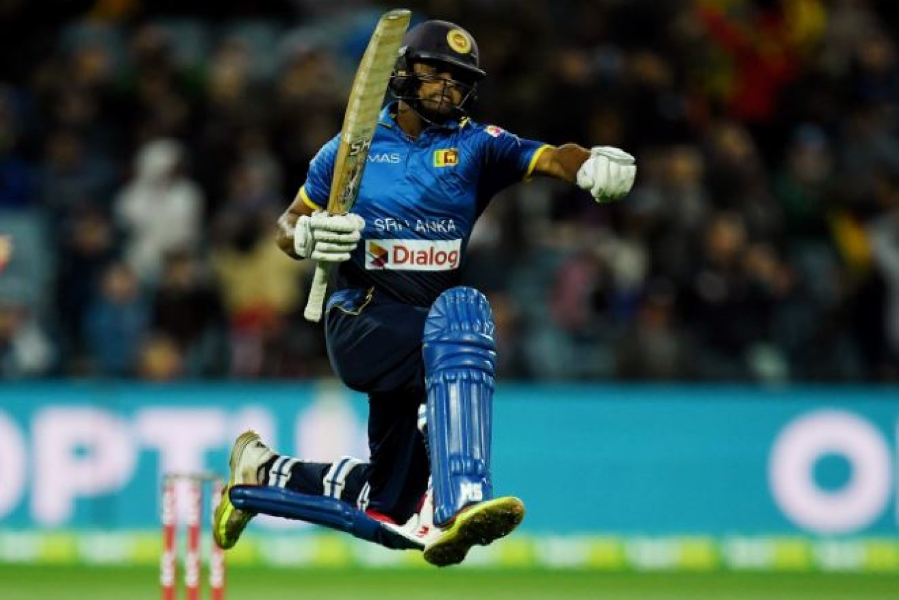 Sri Lanka's Adela Gunaratne jumps for joy on Sunday after scuttling Australia's hopes of winning the three-game series.